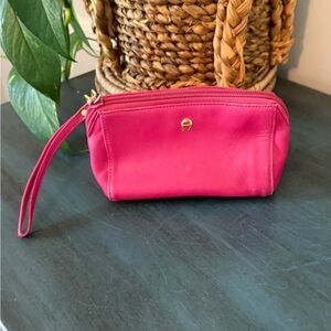 ETIENNE AIGNER pink leather wristlet or cosmetic pouch with A logo.